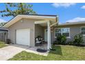 A cozy front porch area with seating, plants, and a welcoming entrance at 1312 S Evergreen Ave, Clearwater, FL 33756