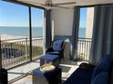 Relax on the balcony with comfortable seating and enjoy panoramic ocean views on a sunny day at 1380 Gulf Blvd # 805, Clearwater, FL 33767
