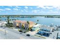 Waterfront townhome community with balconies and garages, situated on a scenic waterway with nearby ocean access at 17817 Gulf Blvd # A, St Petersburg, FL 33708