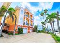 Multi-story townhomes with balconies, attached garages and colorful landscaping near a waterway at 17817 Gulf Blvd # A, St Petersburg, FL 33708