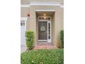 Inviting front door with decorative wreath and sidelight window feature at 3053 Pointeview Dr, Tampa, FL 33611