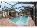 Screened in pool with covered patio perfect for hot summer days at 3509 King George Ln, Seffner, FL 33584
