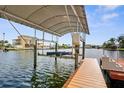 Covered boat lift provides protection and convenience for watercraft, ensuring easy access to the open water at 4523 Gulfstream Dr, Hernando Beach, FL 34607