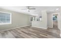 Bright living room featuring modern wood floors, ample natural light, and neutral decor at 5048 5Th S Ave, St Petersburg, FL 33707