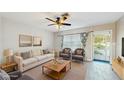 Bright living room featuring a sofa, chairs, and stylish decor at 6901 10Th N St, St Petersburg, FL 33702