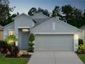 Charming single-Gathering home with well-manicured lawn, two-car garage, and inviting curb appeal at 14320 Tree Swallow Way, Lakewood Ranch, FL 34202