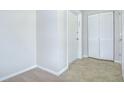 Clean and bright foyer featuring neutral paint, closet, and durable flooring at 1799 N Highland Ave # 185, Clearwater, FL 33755