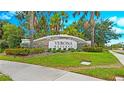 View of the Verona Reserve community sign with lush green landscaping and a clear blue sky at 2527 Terracina Dr, Venice, FL 34292
