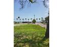 An idyllic beach setting with blue skies and palm trees in a great community at 3108 56Th S St, Gulfport, FL 33707