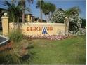 Beachwalk community sign with palm trees and colorful flowers at 4305 Bayside Village Dr # 301, Tampa, FL 33615