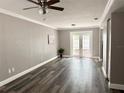 Inviting living area with new flooring, and sliding glass doors to the patio at 5229 Tennis Court Circle, Tampa, FL 33617