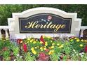 Heritage community sign features colorful flowers in foreground at 5519 Reflections Blvd, Lutz, FL 33558