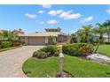 Beautifully landscaped front yard leads to this charming home with a circular driveway at 5782 Westshore Dr, New Port Richey, FL 34652