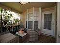 Cozy enclosed patio with neutral furniture, a bay window, and decor at 6424 Thicket Trl, New Port Richey, FL 34653