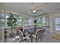 Enclosed patio filled with natural light, offering a cozy seating area for dining and relaxing at 1111 Golfview Woods Dr # 1111, Sun City Center, FL 33573