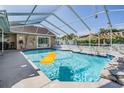 Enjoy the Florida lifestyle with this screened-in pool area, perfect for relaxation and fun at 13386 Lawrence St, Spring Hill, FL 34609