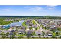 A vibrant aerial view shows a community with picturesque ponds and lush green spaces at 13913 Felix Will Rd, Riverview, FL 33579