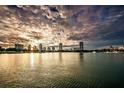 Waterfront view of the city skyline at sunset with boats on the water, beautiful setting at 146 26Th Ne Ave, St Petersburg, FL 33704