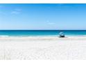 Beautiful beach scene with white sand and clear blue water, perfect for relaxation at 19531 Gulf Blvd # 306, Indian Shores, FL 33785