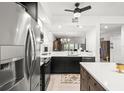 The bright kitchen is equipped with stainless steel appliances and sleek black and white cabinetry at 6330 99Th N Way # 14B, Seminole, FL 33708