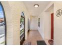 Welcoming entryway with tile floors, arched openings and decorative accents at 6346 Bonnie Bay N Cir, Pinellas Park, FL 33781