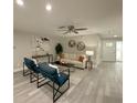 Bright and inviting living room with modern decor, comfortable seating, and plenty of natural light at 939 Woodland Dr, Palm Harbor, FL 34683