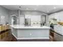 Stylish kitchen features white cabinetry, stainless steel appliances, and sleek counter tops at 9608 Greenpointe Dr, Tampa, FL 33626