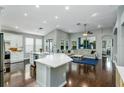 Spacious living area features a large island, modern fixtures, and an open floor plan at 9608 Greenpointe Dr, Tampa, FL 33626