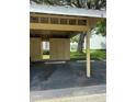 Assigned covered parking space with storage lockers, providing convenient parking for residents of this beautiful community at 1408 Millstream Ln # 206, Dunedin, FL 34698