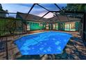 Inviting screened-in pool with brick paver deck, ideal for outdoor relaxation and entertaining at 2459 Parkstream Ave, Clearwater, FL 33759