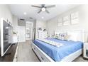 Serene main bedroom with a plush bed, soft decor, and an ensuite bathroom creating a relaxing retreat at 30762 Parrot Reef Ct, Wesley Chapel, FL 33545