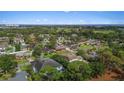 A charming home nestled within a lush green neighborhood with scenic water views in the distance at 3235 Walnut Ne St, St Petersburg, FL 33704