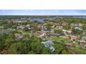 A home nestled in a lush, green neighborhood with scenic water views visible in the distance at 3235 Walnut Ne St, St Petersburg, FL 33704