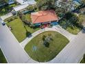 Aerial view of the home showcasing its location, lot, and neighborhood at 431 Windward Psge, Clearwater Beach, FL 33767