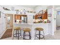 Bright eat-in kitchen with stainless steel appliances, marble counter tops and breakfast bar seating at 5013 119Th E Ter, Parrish, FL 34219