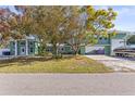 The property boasts ample parking, lush landscaping, and a well-maintained exterior at 5657 Oceanic Rd, Holiday, FL 34690