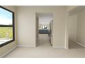Open concept living room with a view to the kitchen, large windows and neutral color scheme at 650 Island Way # 408, Clearwater Beach, FL 33767