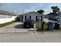 Inviting single-story house with unique stone facade and well-kept lawn at 8234 Ravencroft Dr, Tampa, FL 33615