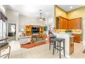 Inviting living room with vaulted ceilings, built-in shelves, and an open floor plan at 8814 N River Rd, Tampa, FL 33635