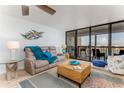 Comfortable living room with a large window that provides natural light and beautiful views at 9525 Blind Pass Rd # 505, St Pete Beach, FL 33706