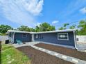 Spacious backyard featuring a cozy fire pit area and easy-to-maintain landscaping at 1416 55Th N Ave, St Petersburg, FL 33703