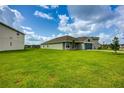 Sprawling front lawn showcases the home's curb appeal and landscaping at 16433 66Th E Ln, Parrish, FL 34219