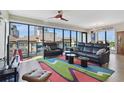 Stylish living room with expansive windows offering cityscape views and comfortable seating area at 199 Dali Blvd # 607, St Petersburg, FL 33701