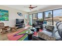 Living room with floor-to-ceiling windows, modern decor and city views, ideal for relaxation at 199 Dali Blvd # 607, St Petersburg, FL 33701