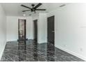 Bright bedroom with marble floors, white walls, and ample closet space at 2010 4Th W Ave, Palmetto, FL 34221