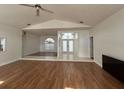 Inviting room with wood flooring, white walls, and ample natural light, perfect for Gathering enjoyment at 2635 Jarvis Cir, Palm Harbor, FL 34683