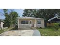 Charming single-story home with a quaint front porch and well-maintained landscaping at 2910 15Th Ave S, St Petersburg, FL 33712