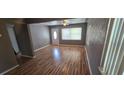 Bright living room featuring sleek wood floors, neutral gray walls, and an open layout at 2910 15Th Ave S, St Petersburg, FL 33712