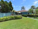 Lush landscaping surrounds this well-maintained building and community at 364 115Th N Ave # 1, St Petersburg, FL 33716