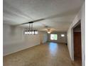 Bright and airy living room with tile floors and updated light fixtures throughout at 422 Crosswinds Dr, Palm Harbor, FL 34683